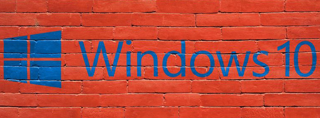 Pared de ladrillos rojos sobre ella pintado en azul: Windows 10 y su logo.