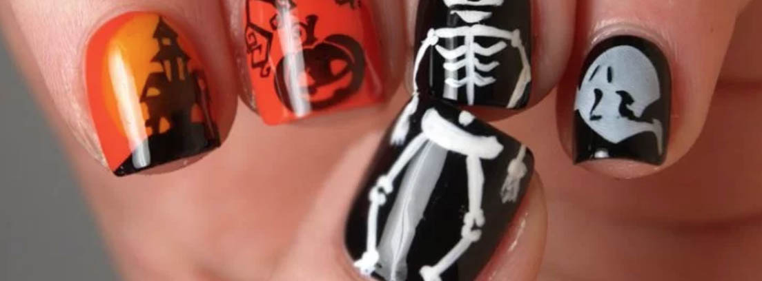 Uñas de Halloween decoradas con calabazas y calaveras